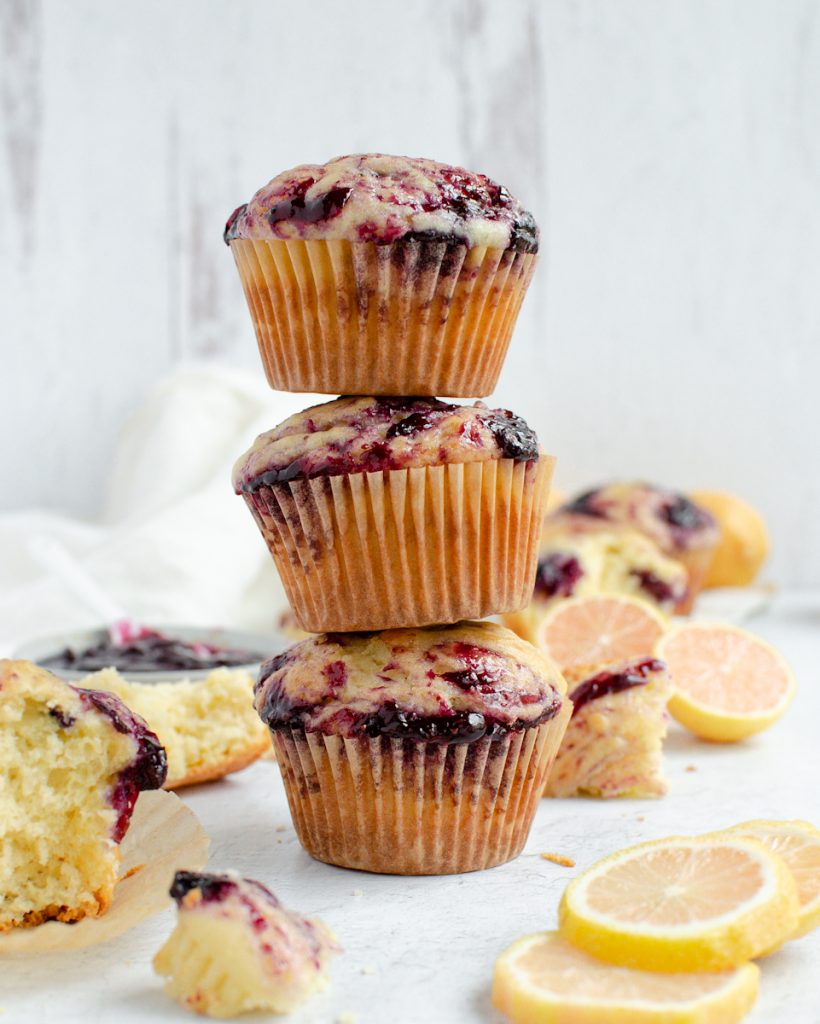 Stack of Lemon Muffins with lemons nearby