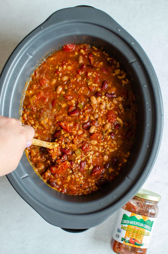 stirring slow cooker game day chili