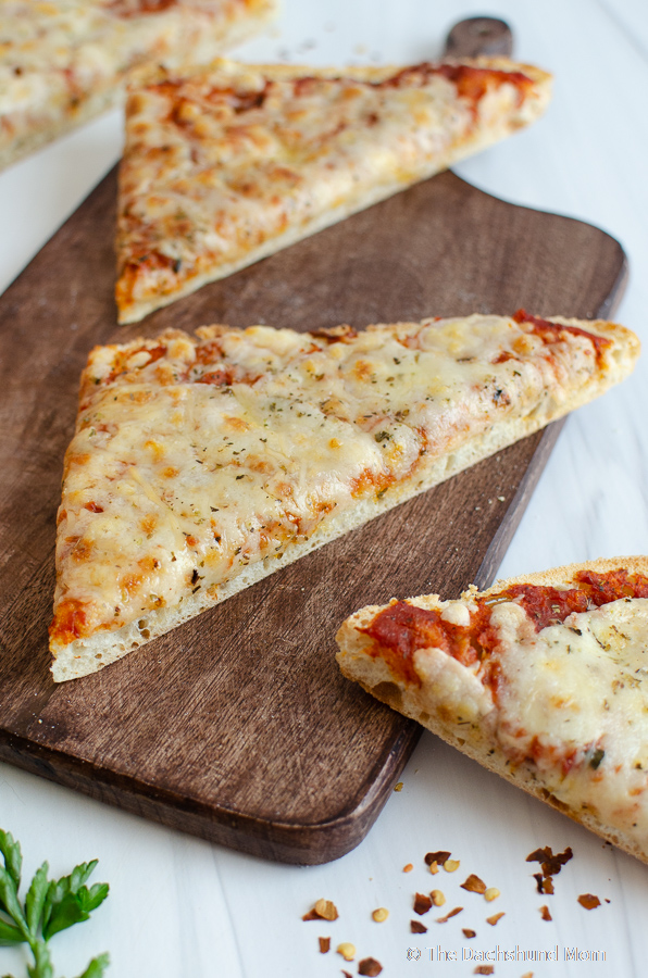 Ciabatta pizza sliced on a board