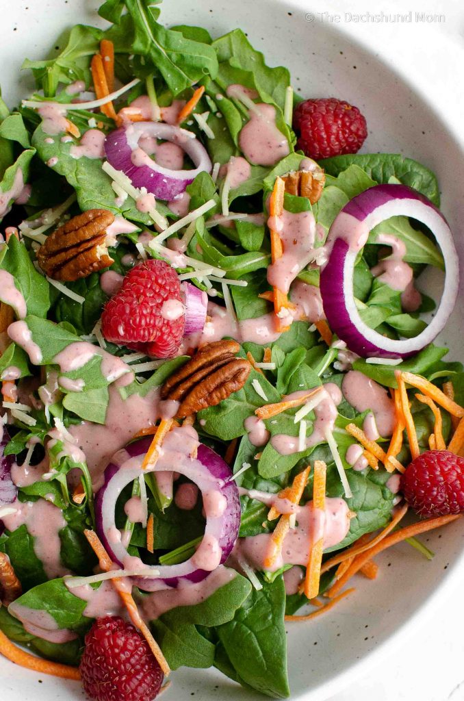 Cranberry salad dressing on a spinach and arugula salad